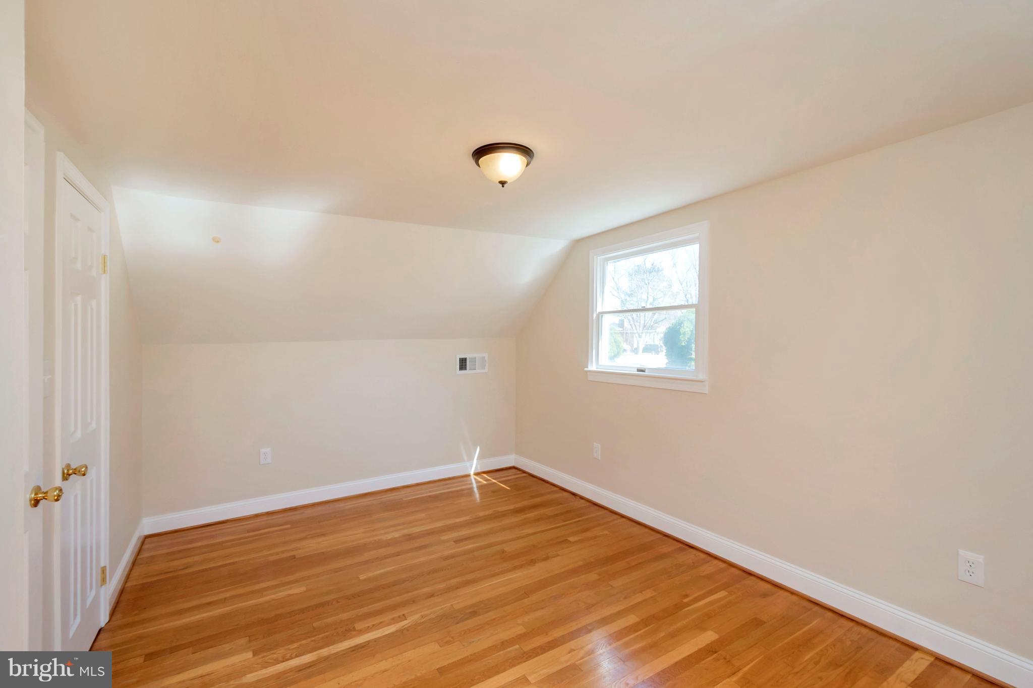 14114 Grayson Road Woodbridge, VA 22191 - Photo 18 of 28 a view of a room with wooden floor and fan