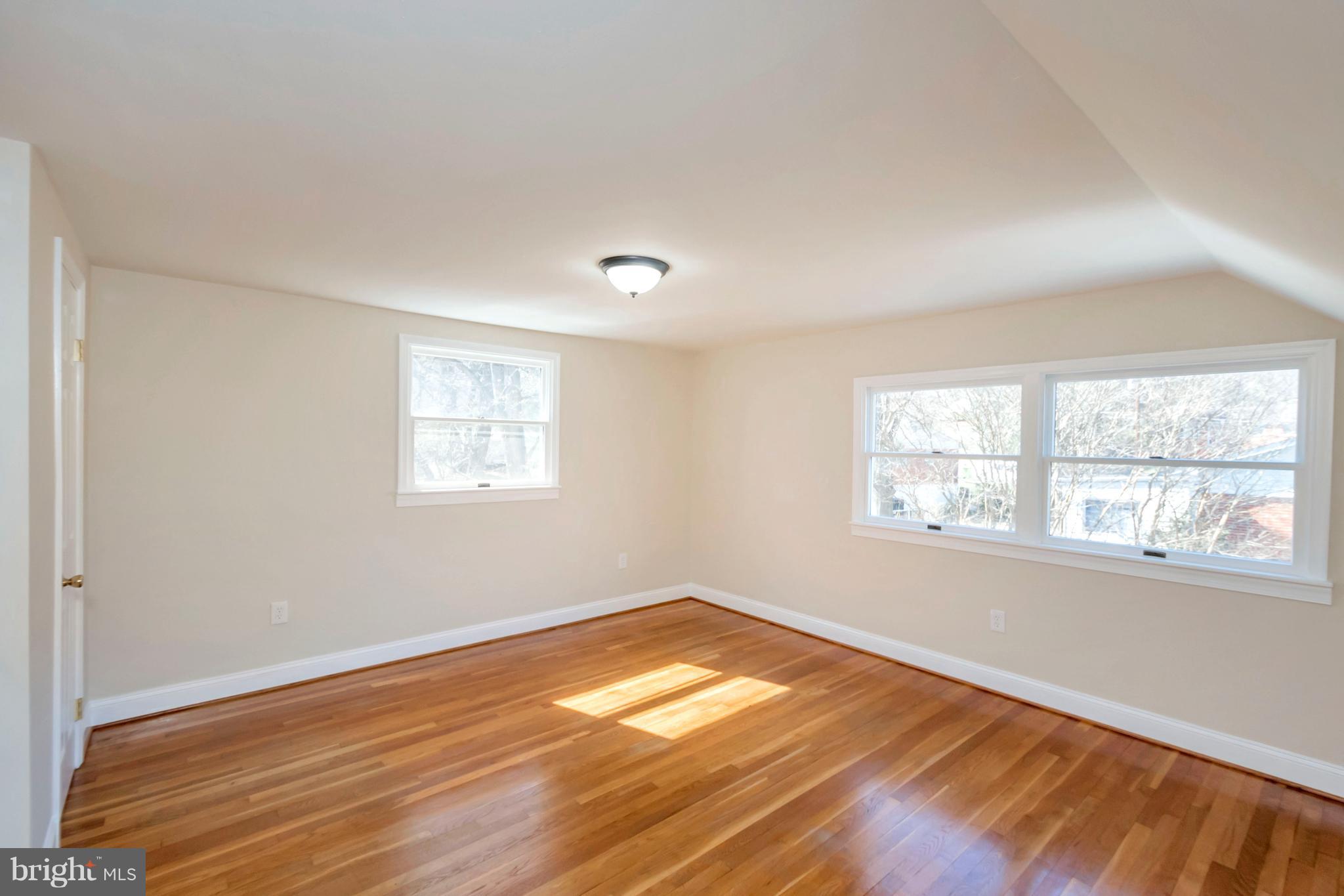 14114 Grayson Road Woodbridge, VA 22191 - Photo 23 of 28 a view of empty room with wooden floor and fan
