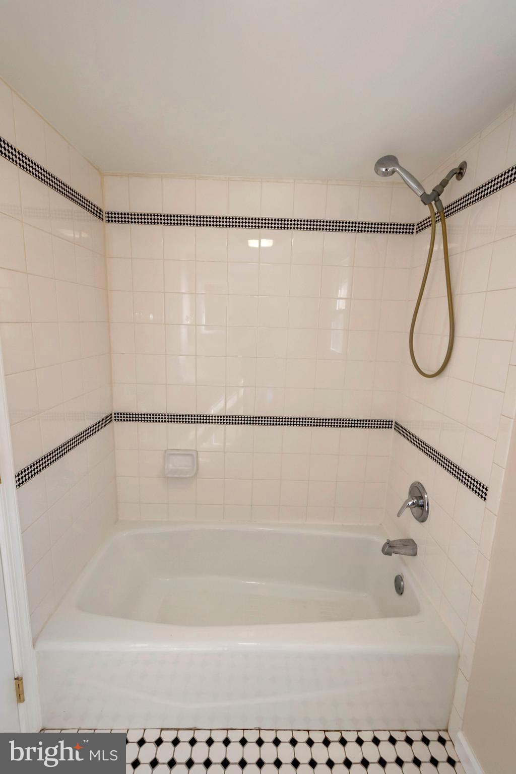 14114 Grayson Road Woodbridge, VA 22191 - Photo 26 of 28 a bathroom with a shower and a bath tub