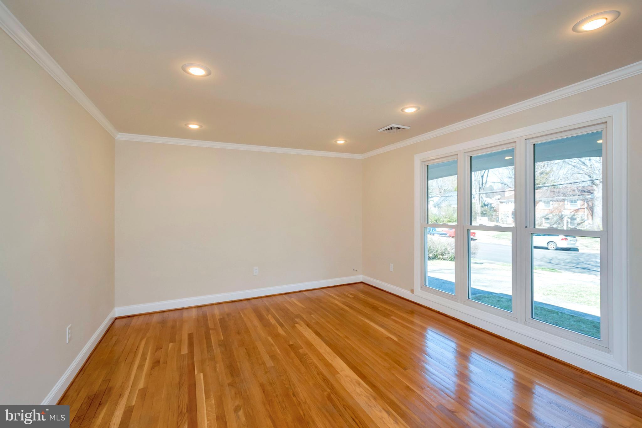 14114 Grayson Road Woodbridge, VA 22191 - Photo 4 of 28 a view of empty room with wooden floor and fan