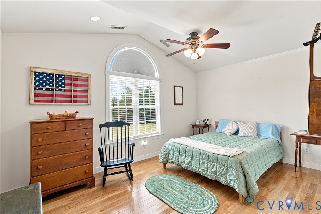 197 Goshen Road Cumberland, VA 23040 - Photo 39 of 70 Vaulted ceiling bedroom with an arched window, woo
