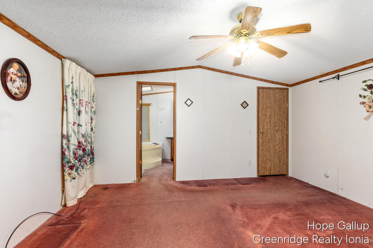 360 East Tuttle Road, Unit 183 Ionia, MI 48846 - Photo 13 of 16 MASTER BED OFF KITCH
