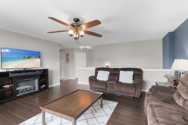 2050 Stapleton Road New Lenox, IL 60451 - Photo 19 of 38 a living room with furniture and a flat screen tv