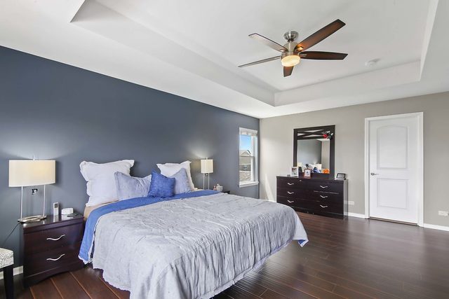 2050 Stapleton Road New Lenox, IL 60451 - Photo 20 of 38 a bedroom with a bed and wooden floor