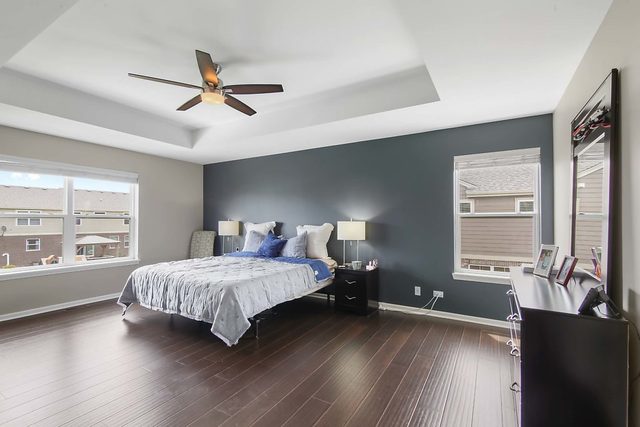 2050 Stapleton Road New Lenox, IL 60451 - Photo 21 of 38 a bedroom with a large bed and a large window