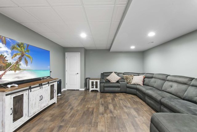 2050 Stapleton Road New Lenox, IL 60451 - Photo 30 of 38 a living room with furniture and a flat screen tv