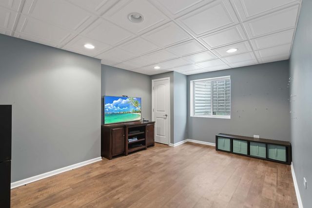 2050 Stapleton Road New Lenox, IL 60451 - Photo 33 of 38 a big room with wooden floor and windows