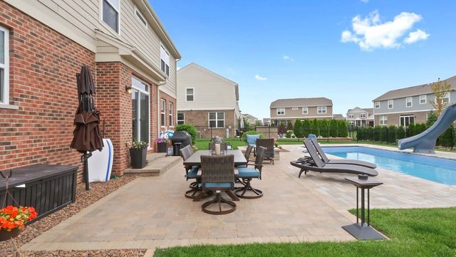 2050 Stapleton Road New Lenox, IL 60451 - Photo 36 of 38 a view of a patio with table and chairs potted plants with wooden floor