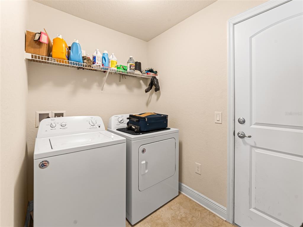 2412 Twin Lake View Road Winter Haven, FL 33881 - Photo 18 of 26 a utility room with dryer and washer