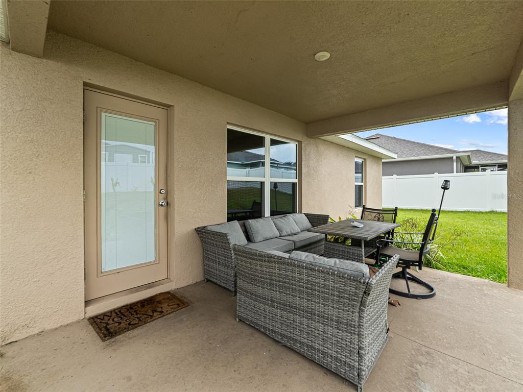 2412 Twin Lake View Road Winter Haven, FL 33881 - Photo 19 of 26 a living room with furniture and a table