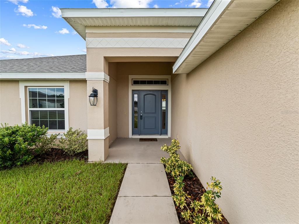2412 Twin Lake View Road Winter Haven, FL 33881 - Photo 2 of 26 a front view of a house with a yard