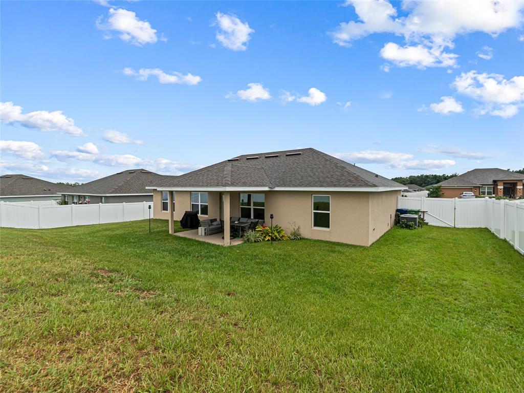 2412 Twin Lake View Road Winter Haven, FL 33881 - Photo 21 of 26 a front view of a house with garden