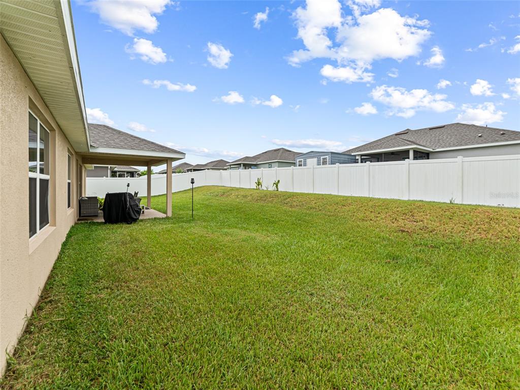 2412 Twin Lake View Road Winter Haven, FL 33881 - Photo 23 of 26 a view of an house with backyard and garden