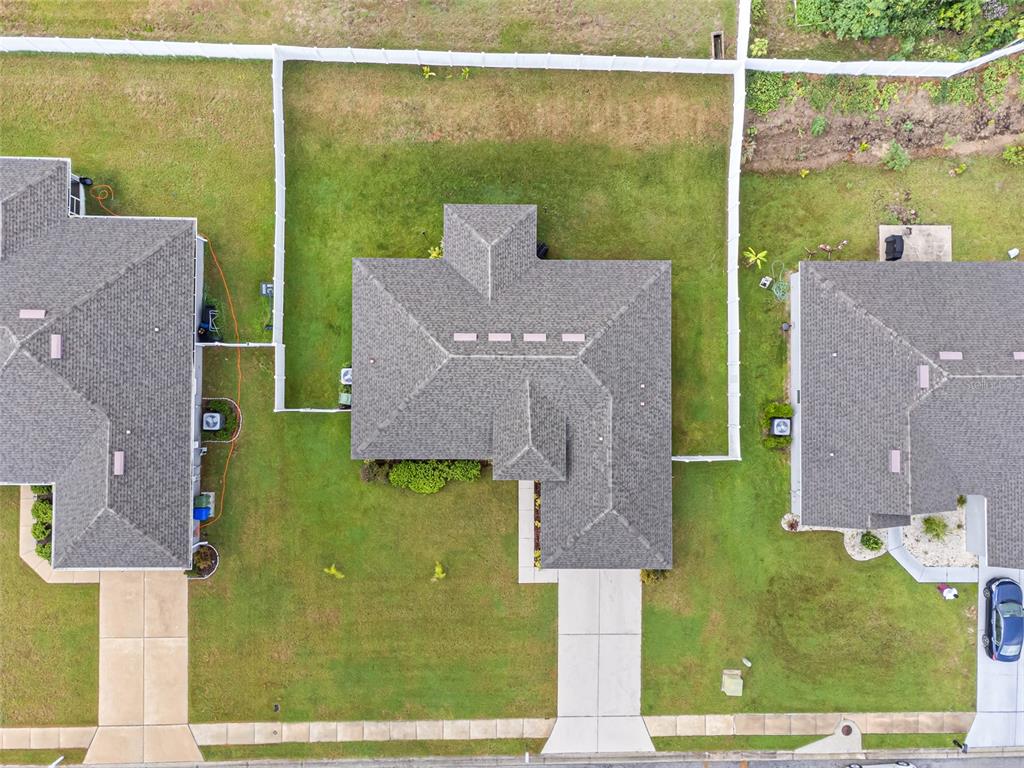 2412 Twin Lake View Road Winter Haven, FL 33881 - Photo 24 of 26 an aerial view of a house with a garden