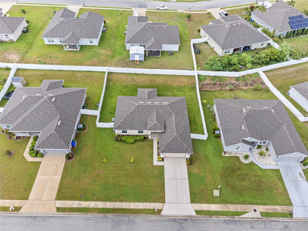 2412 Twin Lake View Road Winter Haven, FL 33881 - Photo 25 of 26 an aerial view of residential houses with outdoor space and parking