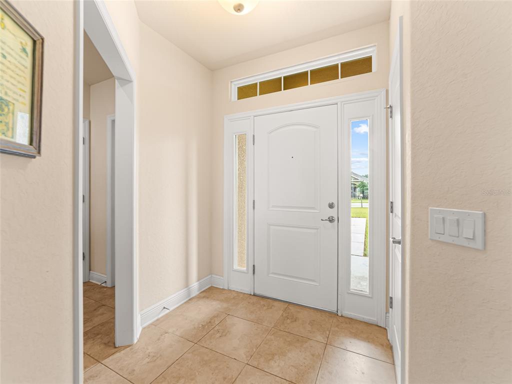 2412 Twin Lake View Road Winter Haven, FL 33881 - Photo 3 of 26 a view of a hallway with front door