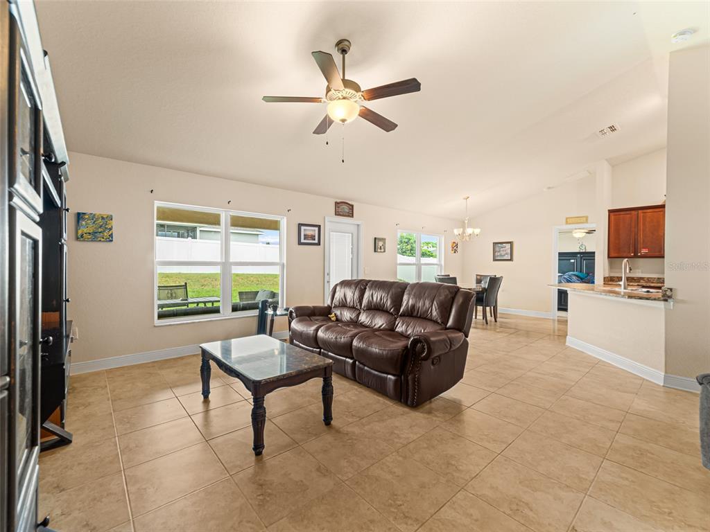 2412 Twin Lake View Road Winter Haven, FL 33881 - Photo 6 of 26 a living room with furniture and a large window