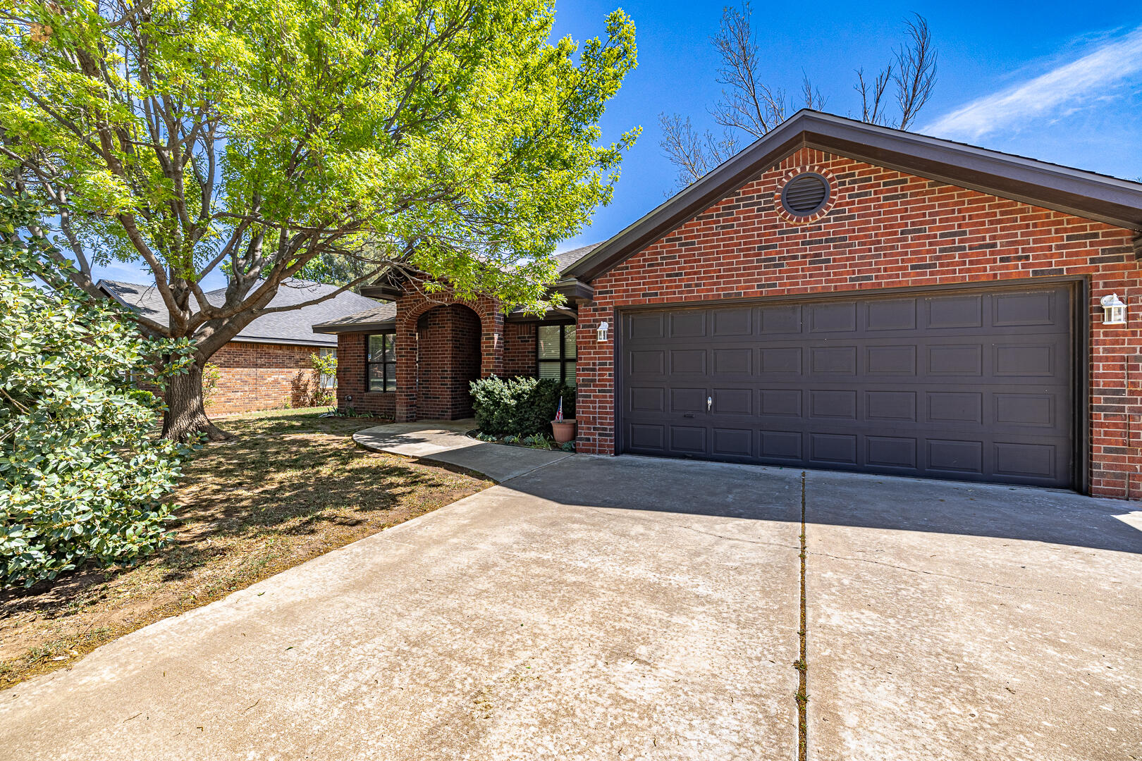 5415 68th Street Lubbock, TX 79424 - Photo 2 of 57 a front view of a house with a yard
