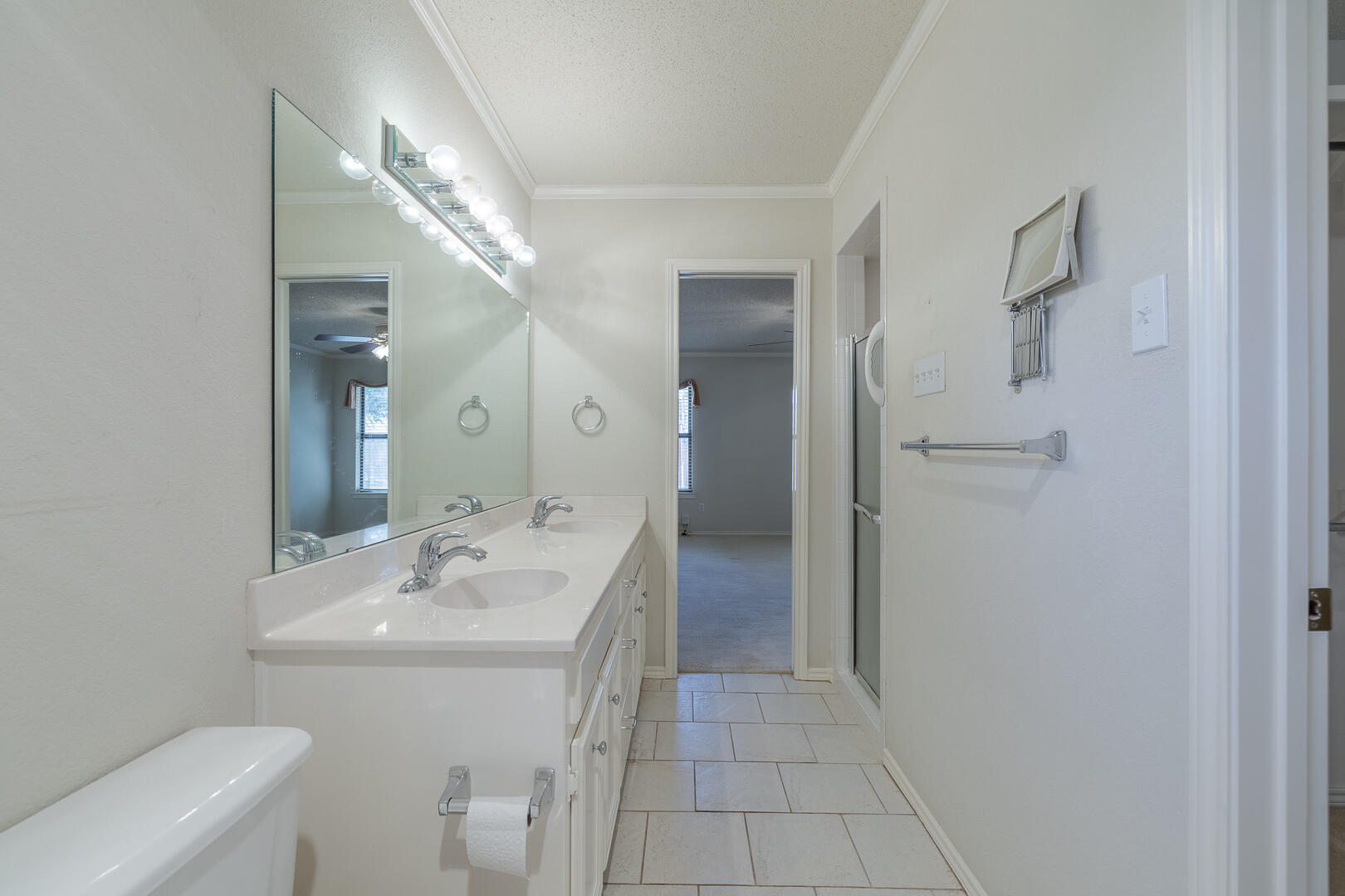5415 68th Street Lubbock, TX 79424 - Photo 21 of 57 a bathroom with a sink toilet and shower