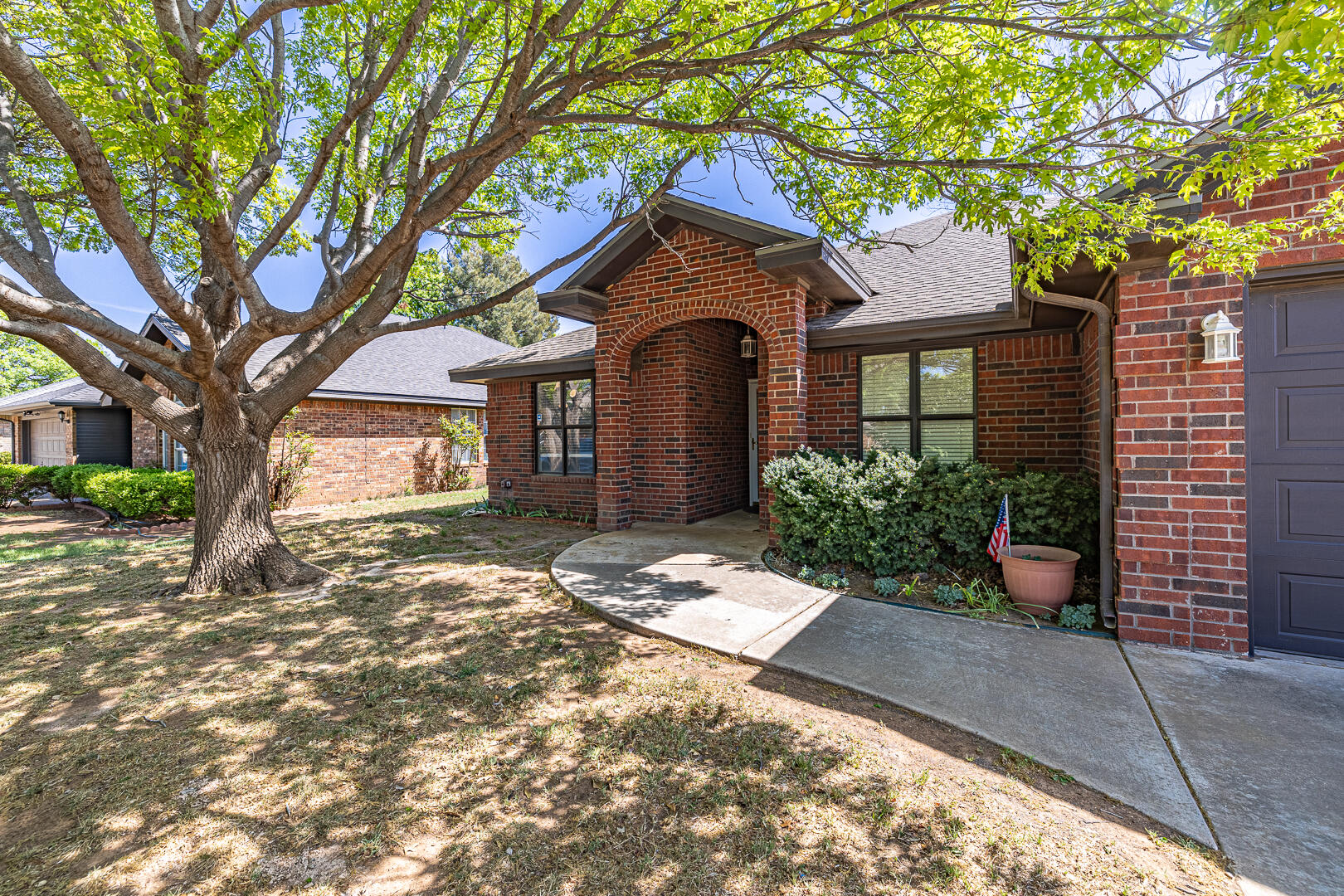 5415 68th Street Lubbock, TX 79424 - Photo 3 of 57 a front view of a house with garden