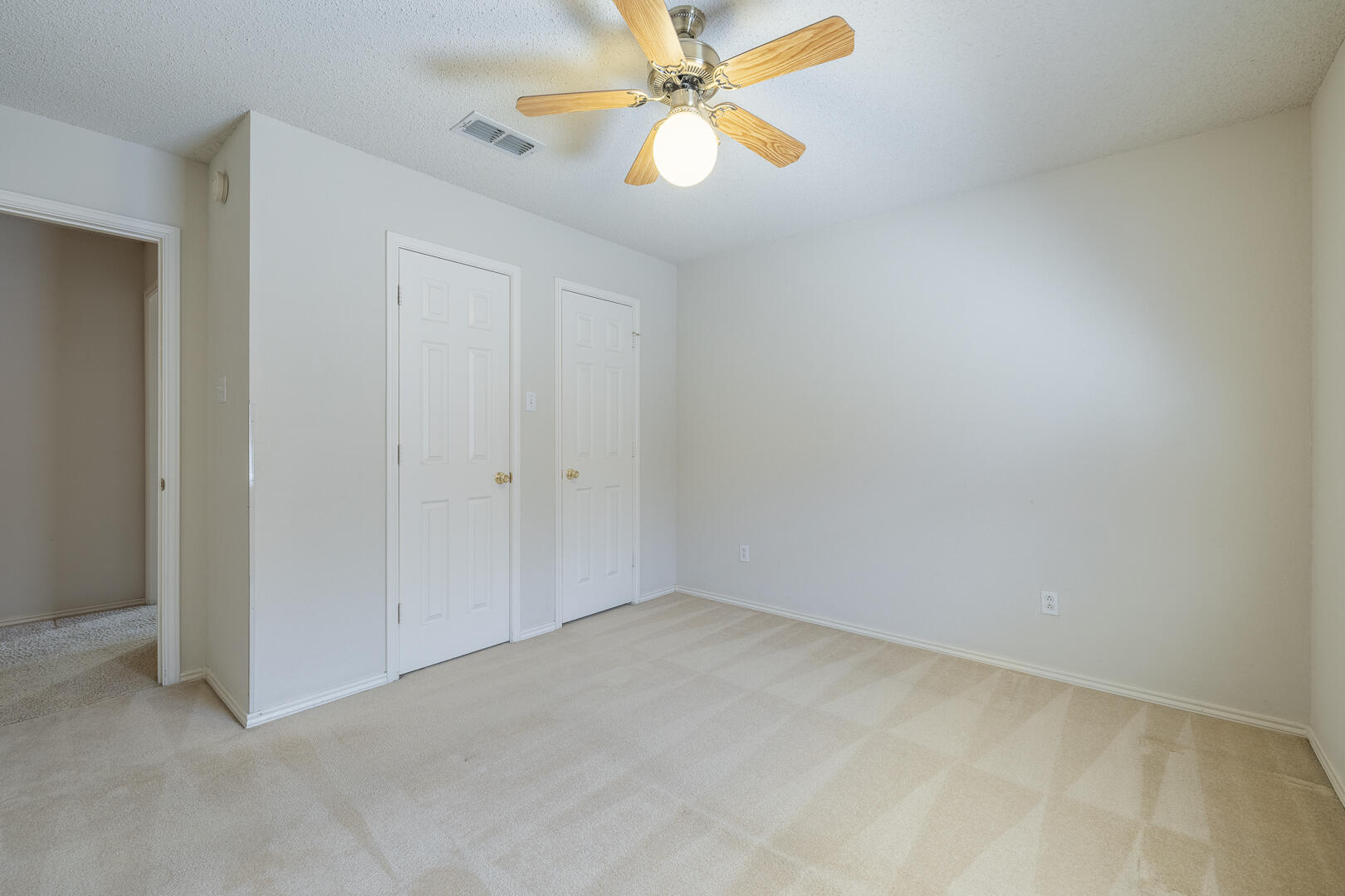 5415 68th Street Lubbock, TX 79424 - Photo 31 of 57 an empty room with a window and a fan