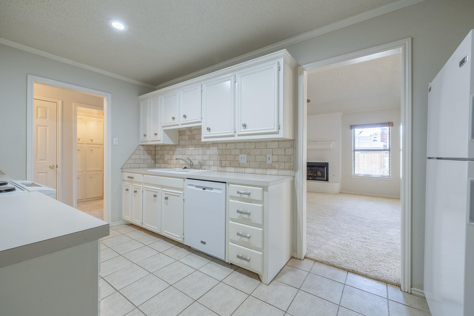 5415 68th Street Lubbock, TX 79424 - Photo 33 of 57 a kitchen with cabinets and window