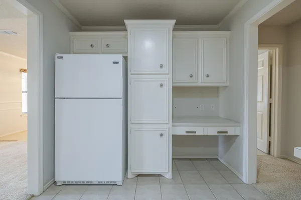 a view of empty room with a fireplace