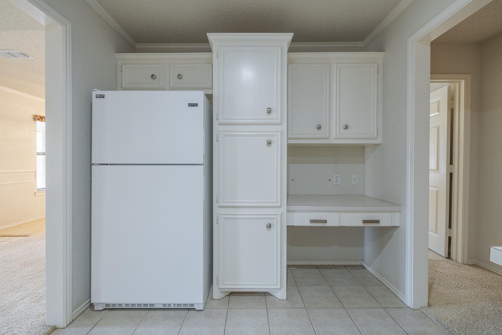 5415 68th Street Lubbock, TX 79424 - Photo 36 of 57 a white refrigerator freezer and a dishwasher in a kitchen