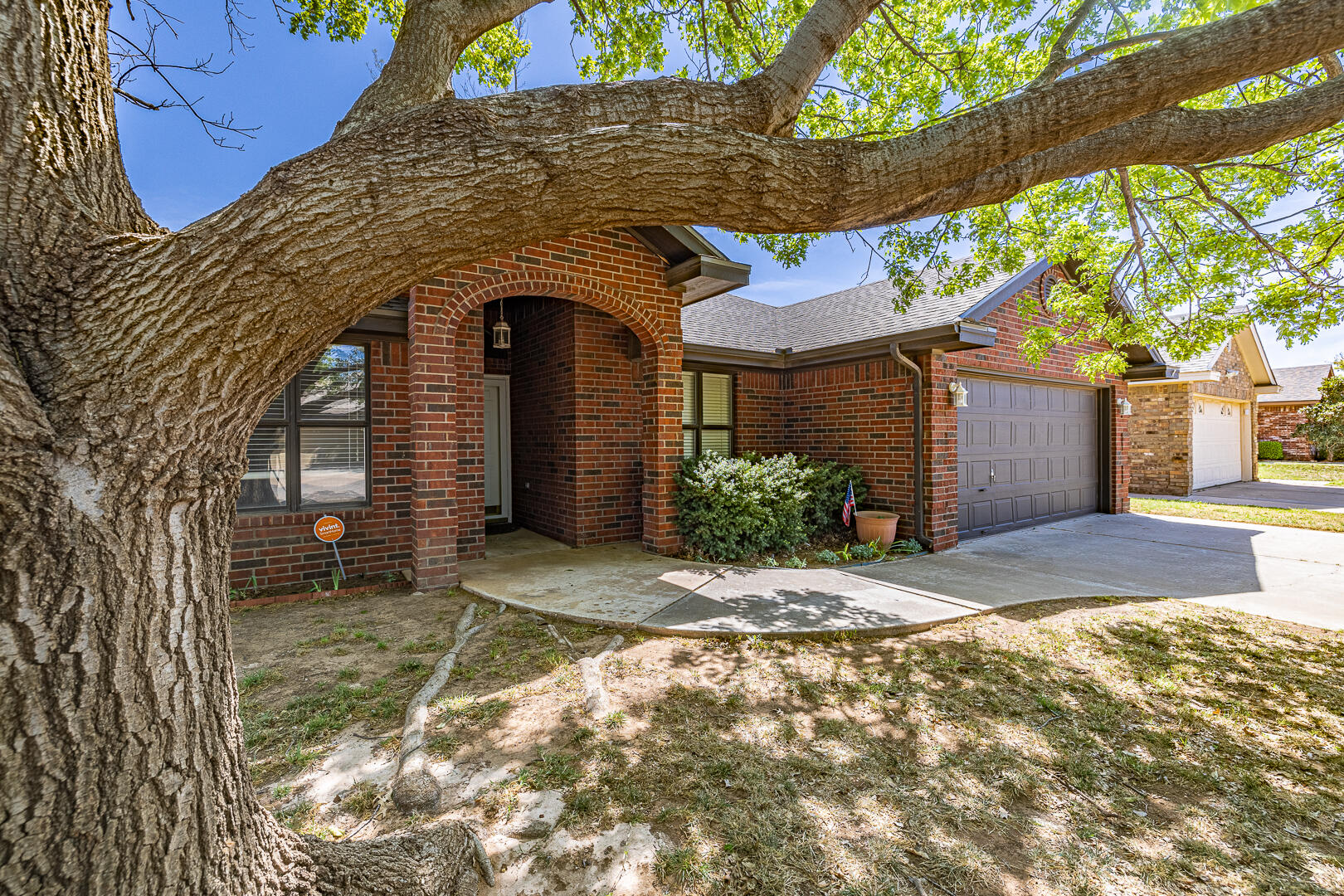 5415 68th Street Lubbock, TX 79424 - Photo 4 of 57 a front view of a house with a yard