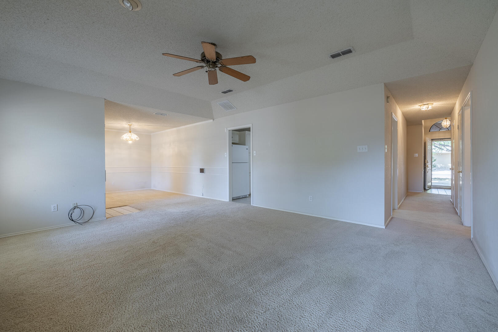 5415 68th Street Lubbock, TX 79424 - Photo 41 of 57 a view of a livingroom with a ceiling fan and window