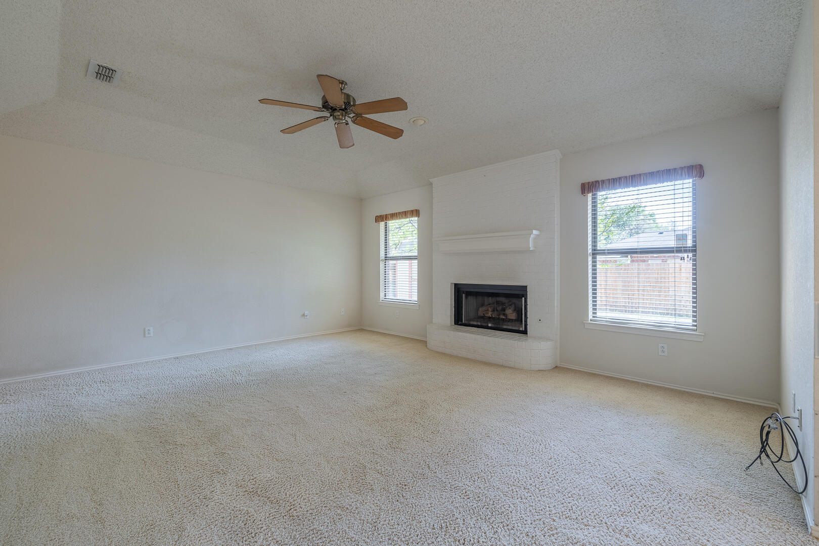 5415 68th Street Lubbock, TX 79424 - Photo 43 of 57 a view of empty room with a fireplace