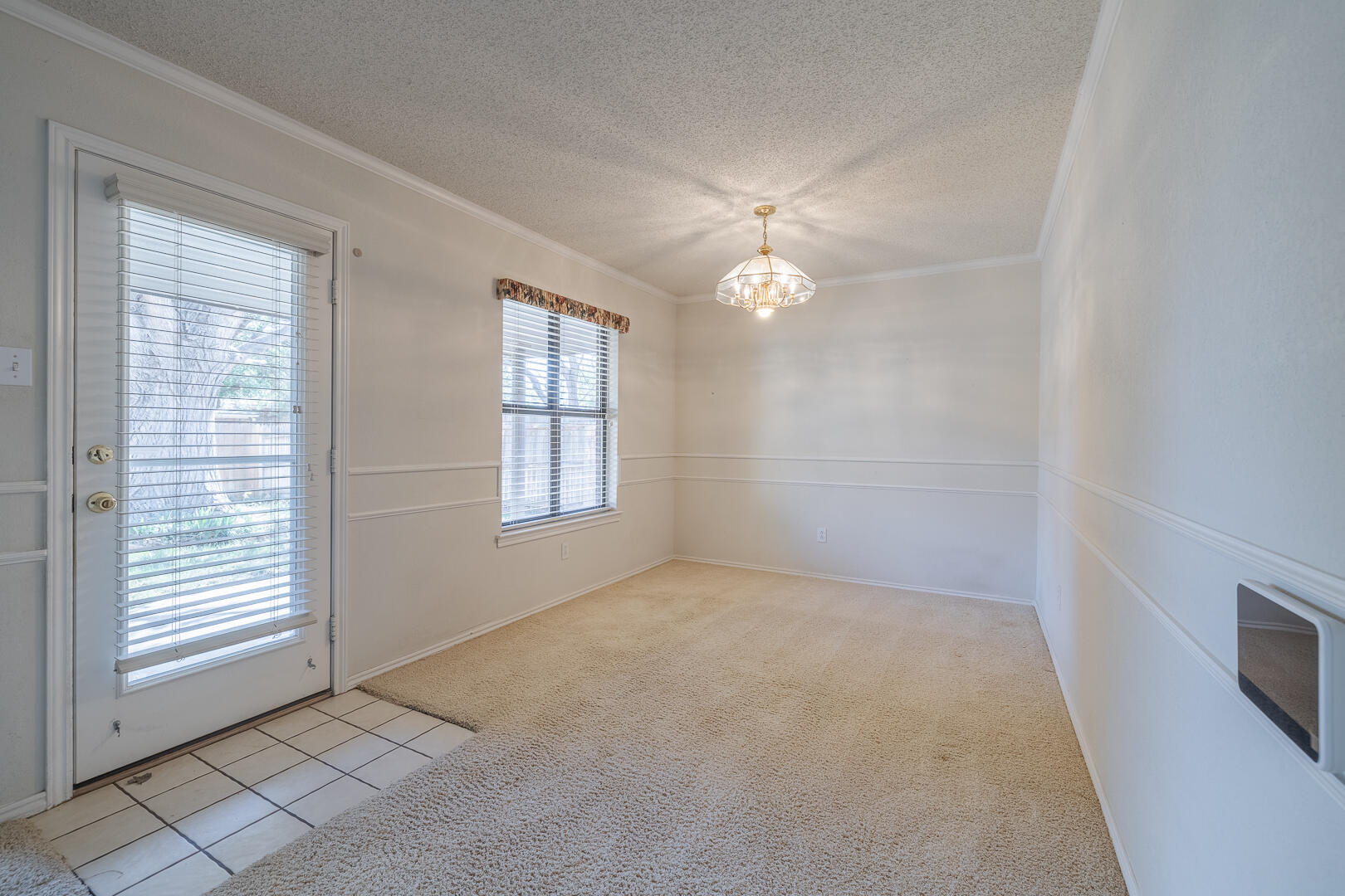 5415 68th Street Lubbock, TX 79424 - Photo 44 of 57 an empty room with windows and fan