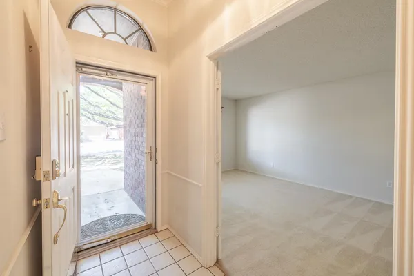 a view of an empty room and window