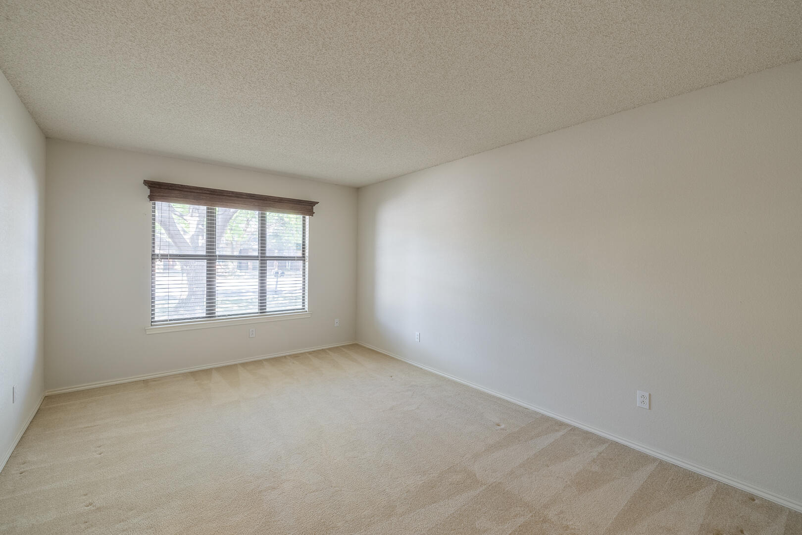 5415 68th Street Lubbock, TX 79424 - Photo 7 of 57 an empty room with a window