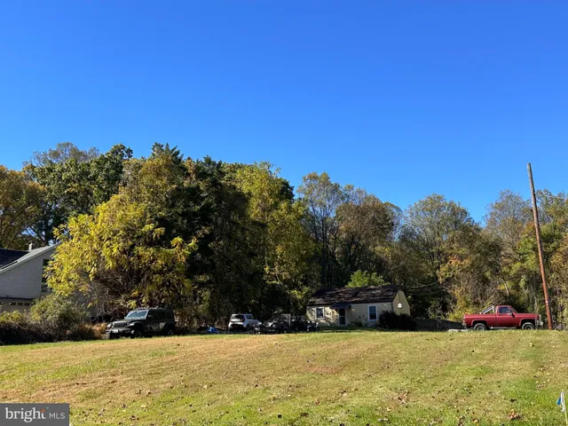 a view of swimming pool with trees in the background