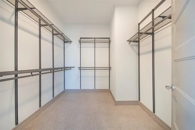 a view of an empty walk in closet