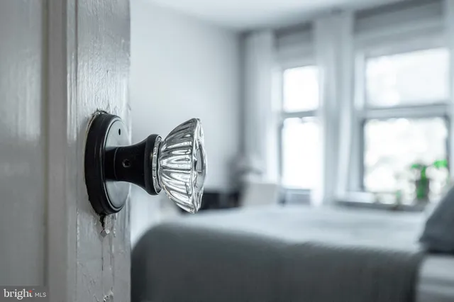 a bedroom with a bed and window