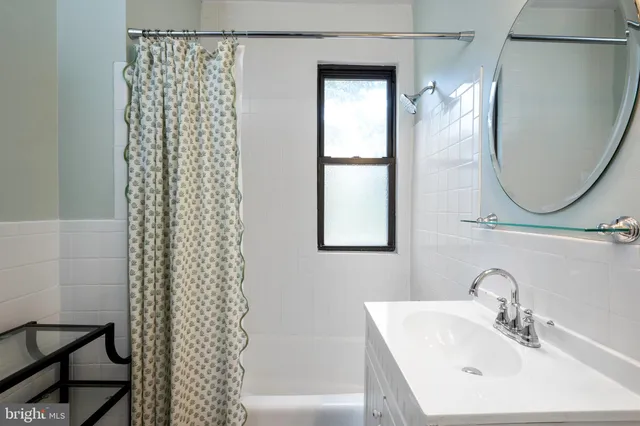 a bathroom with a sink a vanity and a mirror