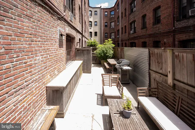 a view of balcony with wooden floor and outdoor seating