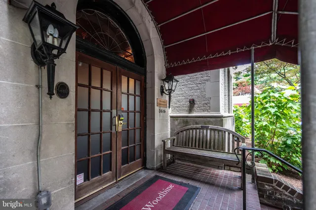 a view of porch with a door and wooden floor