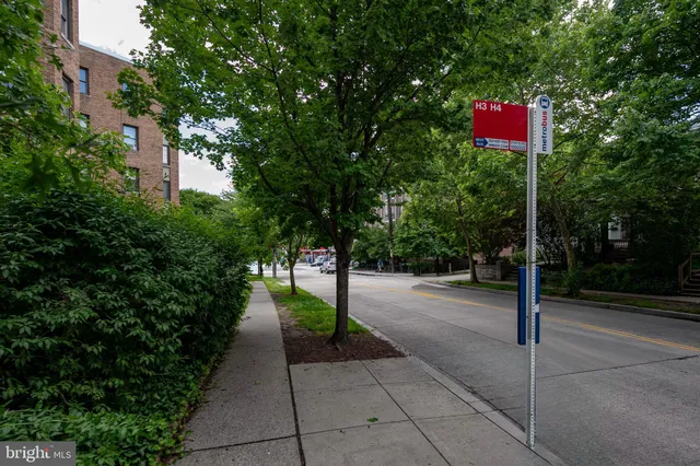 a view of street with parked cars