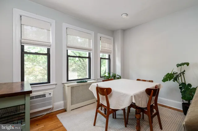 a dining room with furniture and window