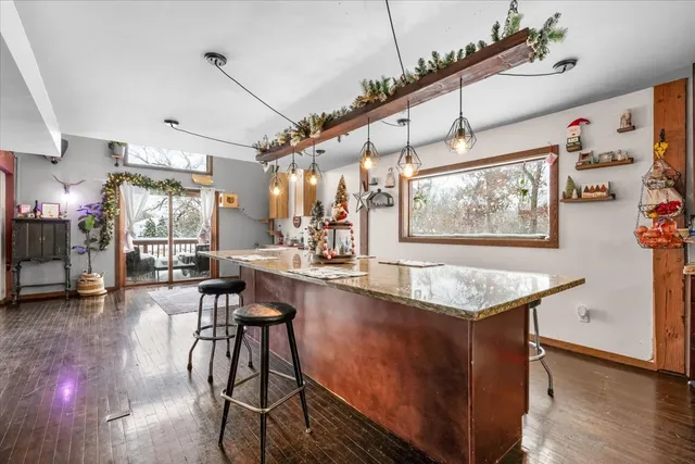 a living room with fireplace furniture and a flat screen tv