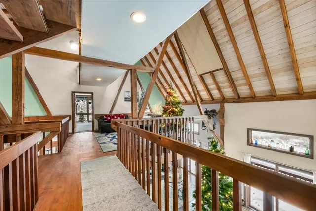 a bedroom with a bed and large window