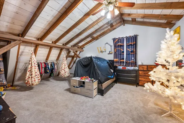 a room with furniture a mirror and entryway