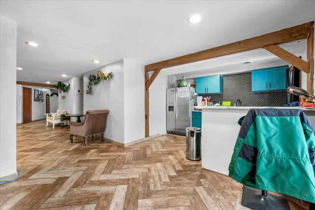 a bed room with a bed and a chair