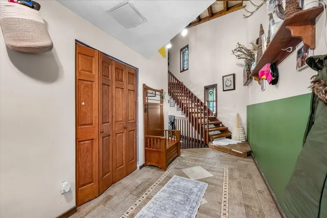 a view of a living room with furniture window and wooden floor