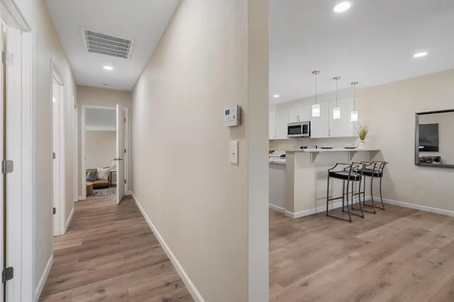 a living room with furniture and a potted plant