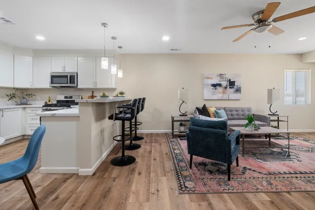 a view of a dining room with furniture and wooden floor