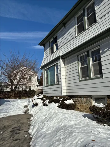 a front view of a house with yard